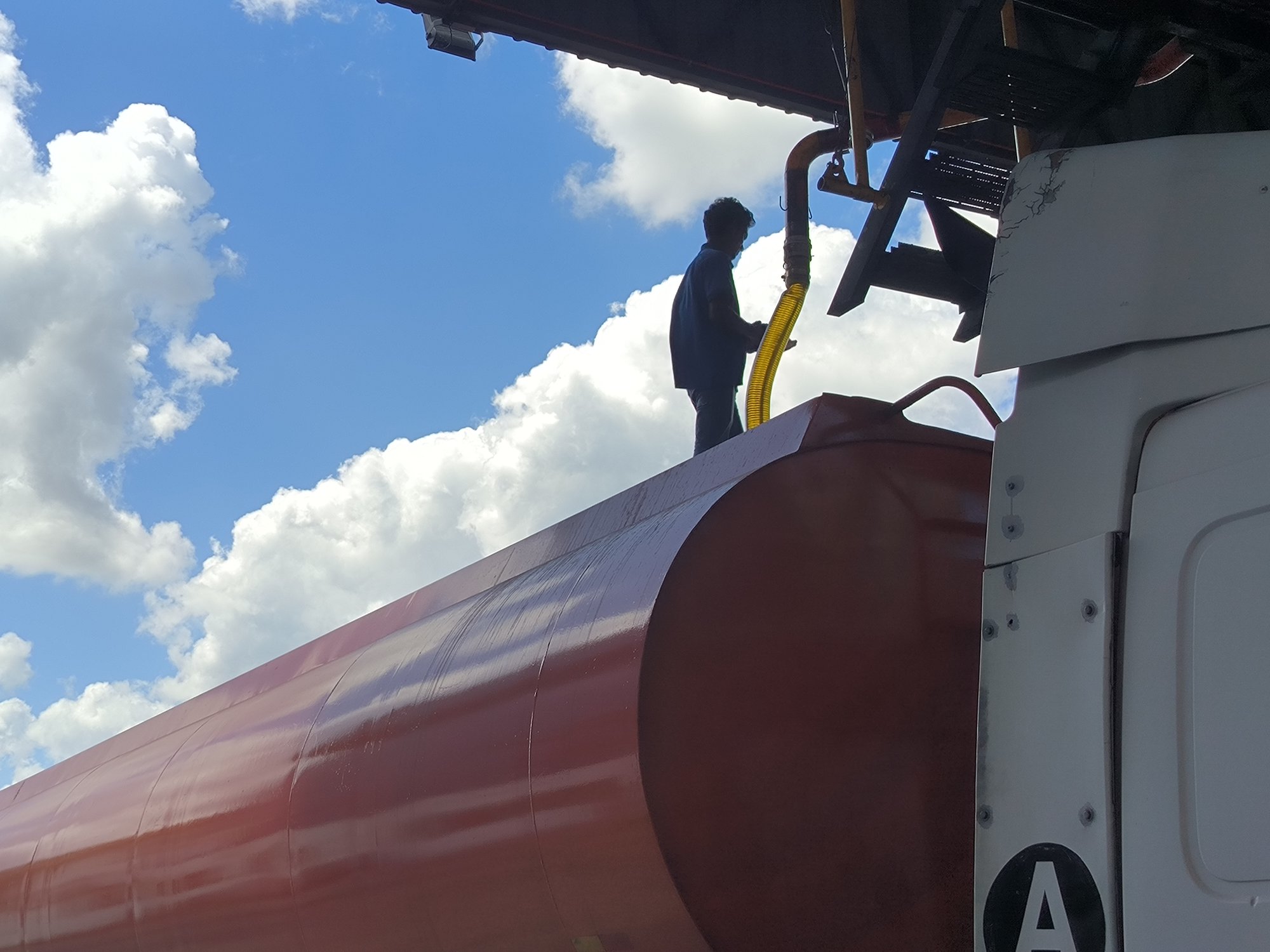 Crude Palm Oil being loaded into a transport tanker